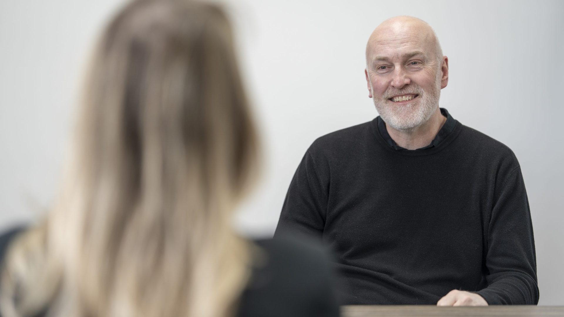 Health and safety consultant kenny scott in a client meeting